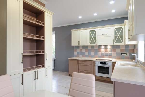 Luxury provence styled modern grey, pink and cream colored kitchen interior